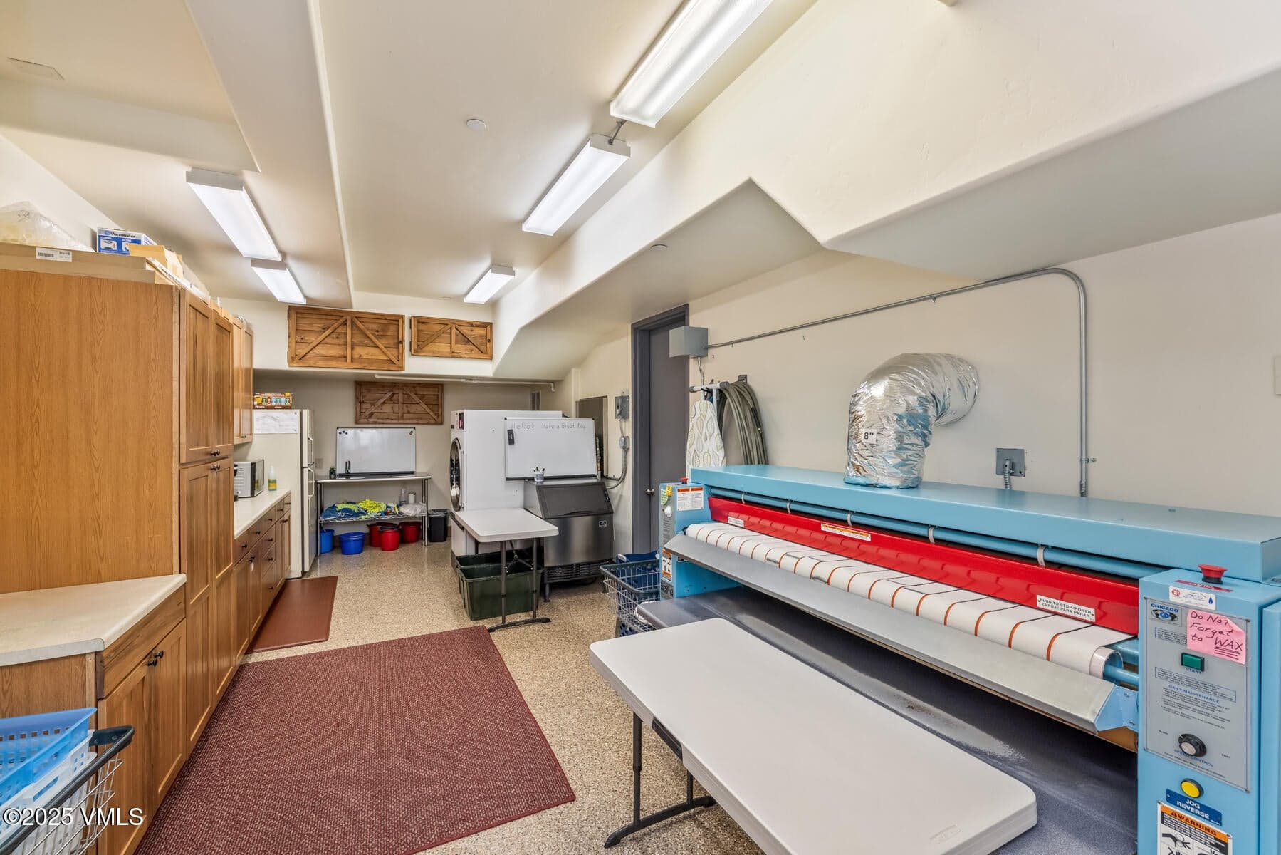 Primary Commercial-Grade Laundry Facility With Sheet Press